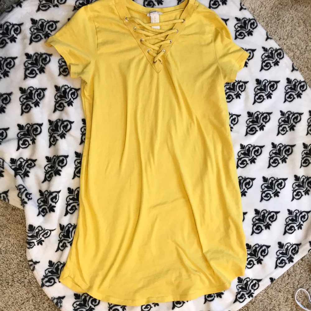 Yellow crisscross v neck shirt